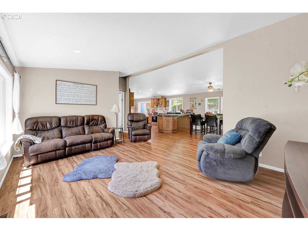 35235 Row River Road Cottage Grove, OR 97424 - Photo 19 of 28 a living room with furniture and a wooden floor