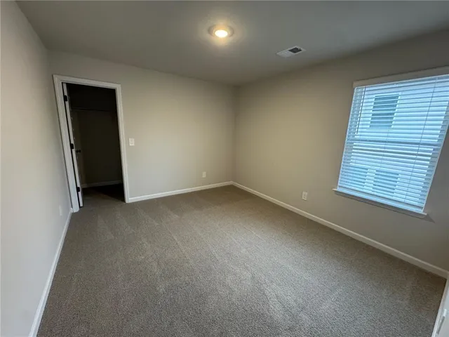a bathroom with a double vanity sink and mirror