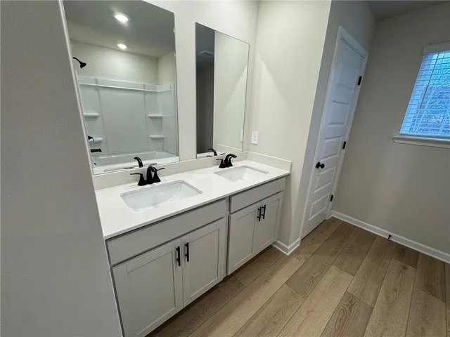 a bathroom with a bathtub and a shower