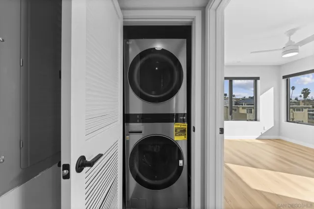a view of a hallway with washer and dryer
