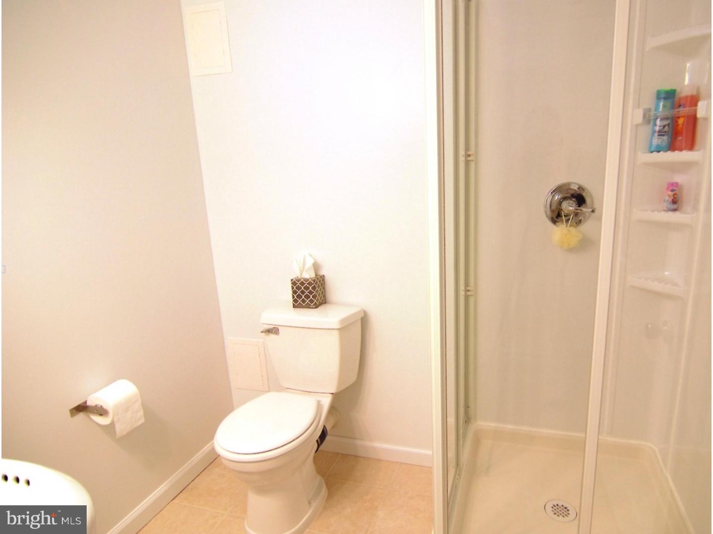 18 Shirley Road Hatboro, PA 19040 - Photo 19 of 24 a white toilet sitting next to a bathroom sink