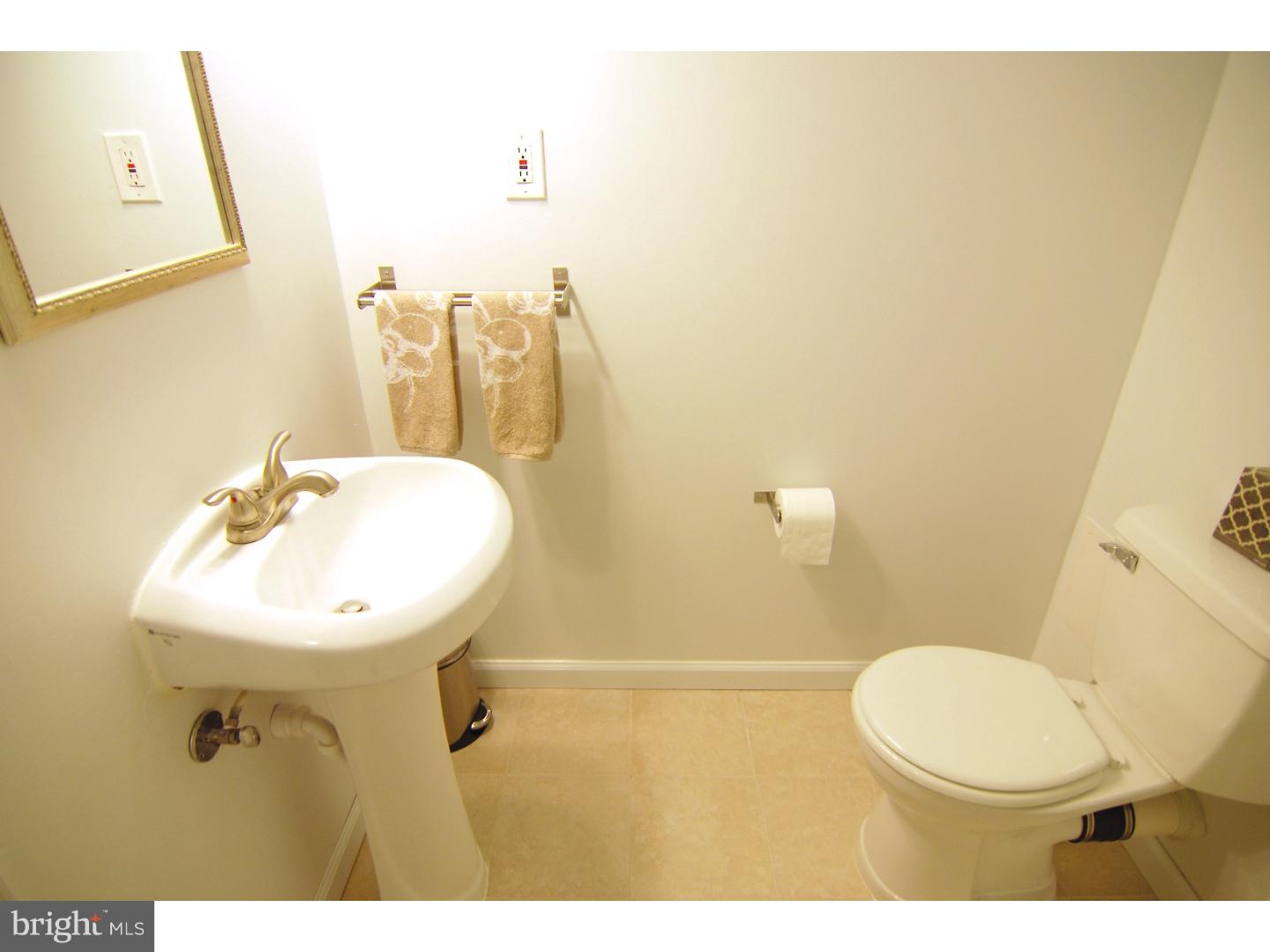 18 Shirley Road Hatboro, PA 19040 - Photo 20 of 24 a bathroom with a sink mirror vanity and toilet