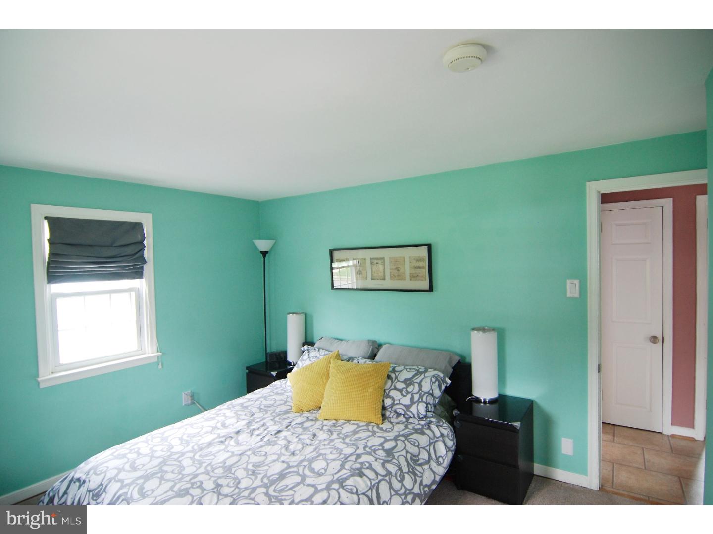 18 Shirley Road Hatboro, PA 19040 - Photo 10 of 24 a bedroom with a bed and a painting on the wall