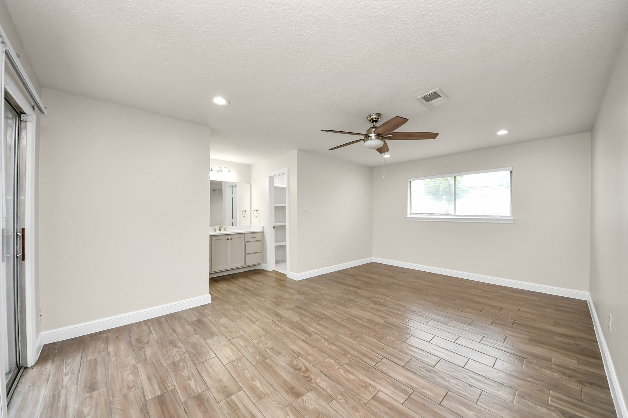 19435 Interstate 45 Spring, TX 77388 - Photo 19 of 24 a view of empty room with wooden floor and fan