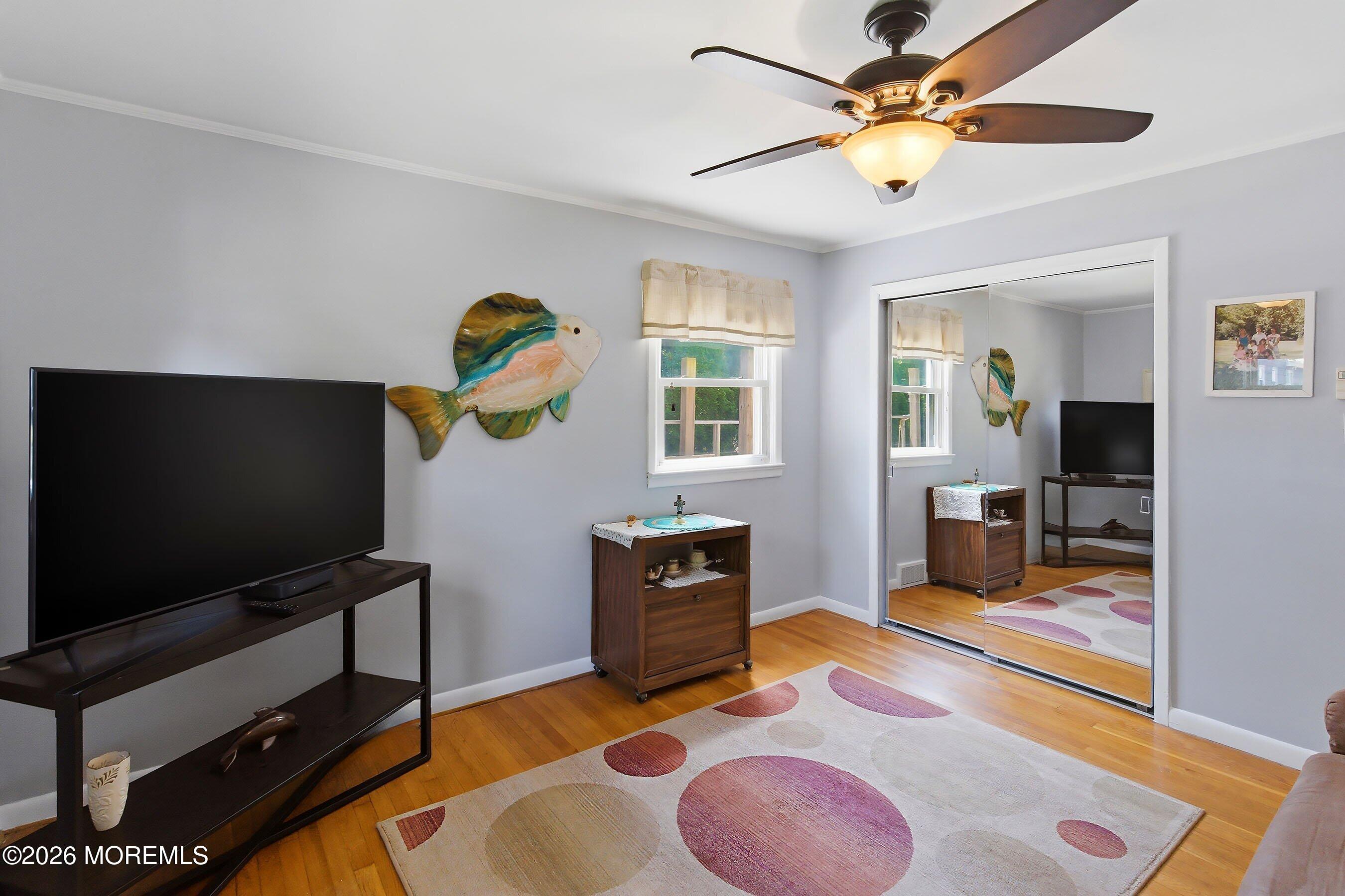 412 Moore Road Neptune Township, NJ 07753 - Photo 16 of 36 a living room with furniture and a flat screen tv