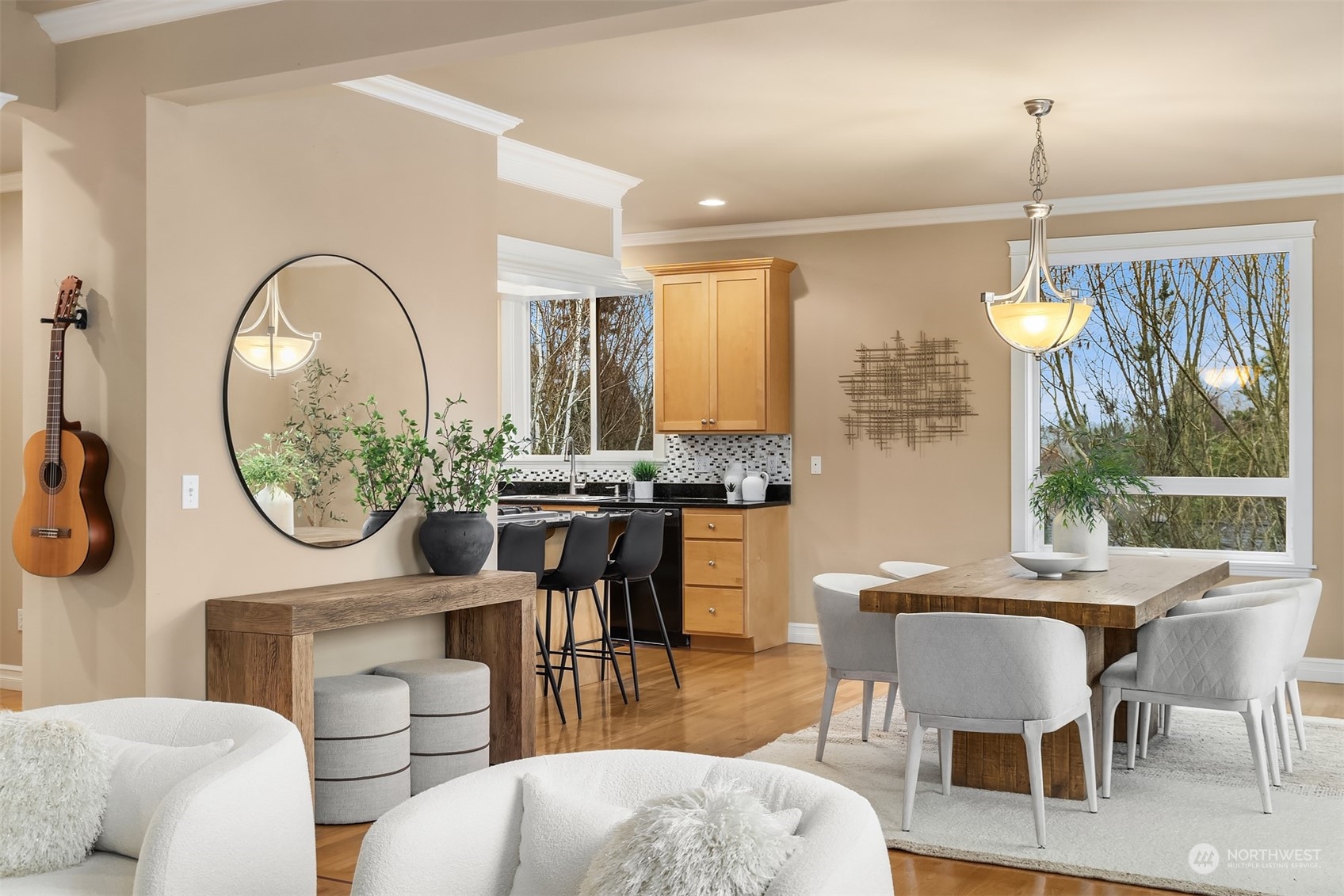 2202 19th Street Anacortes, WA 98221 - Photo 13 of 33 a dining room with furniture a window and a chandelier