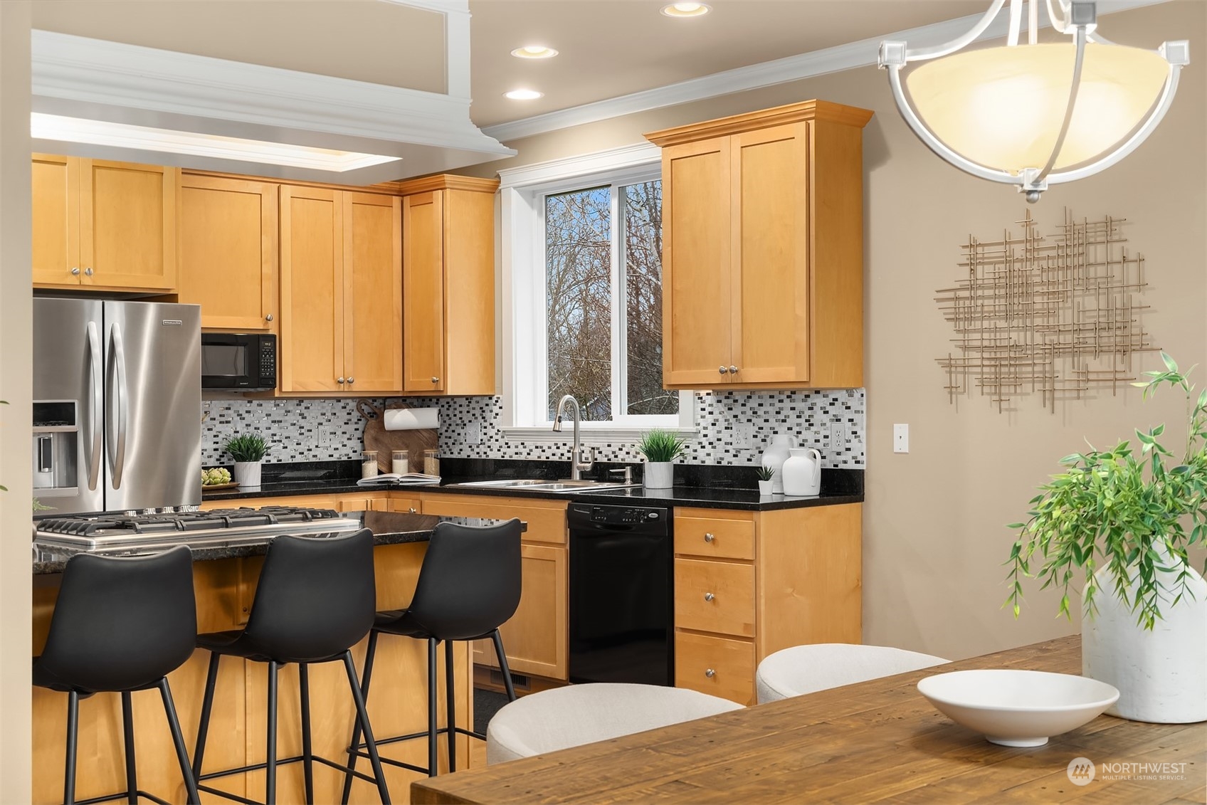 2202 19th Street Anacortes, WA 98221 - Photo 14 of 33 a kitchen with a table chairs sink and cabinets