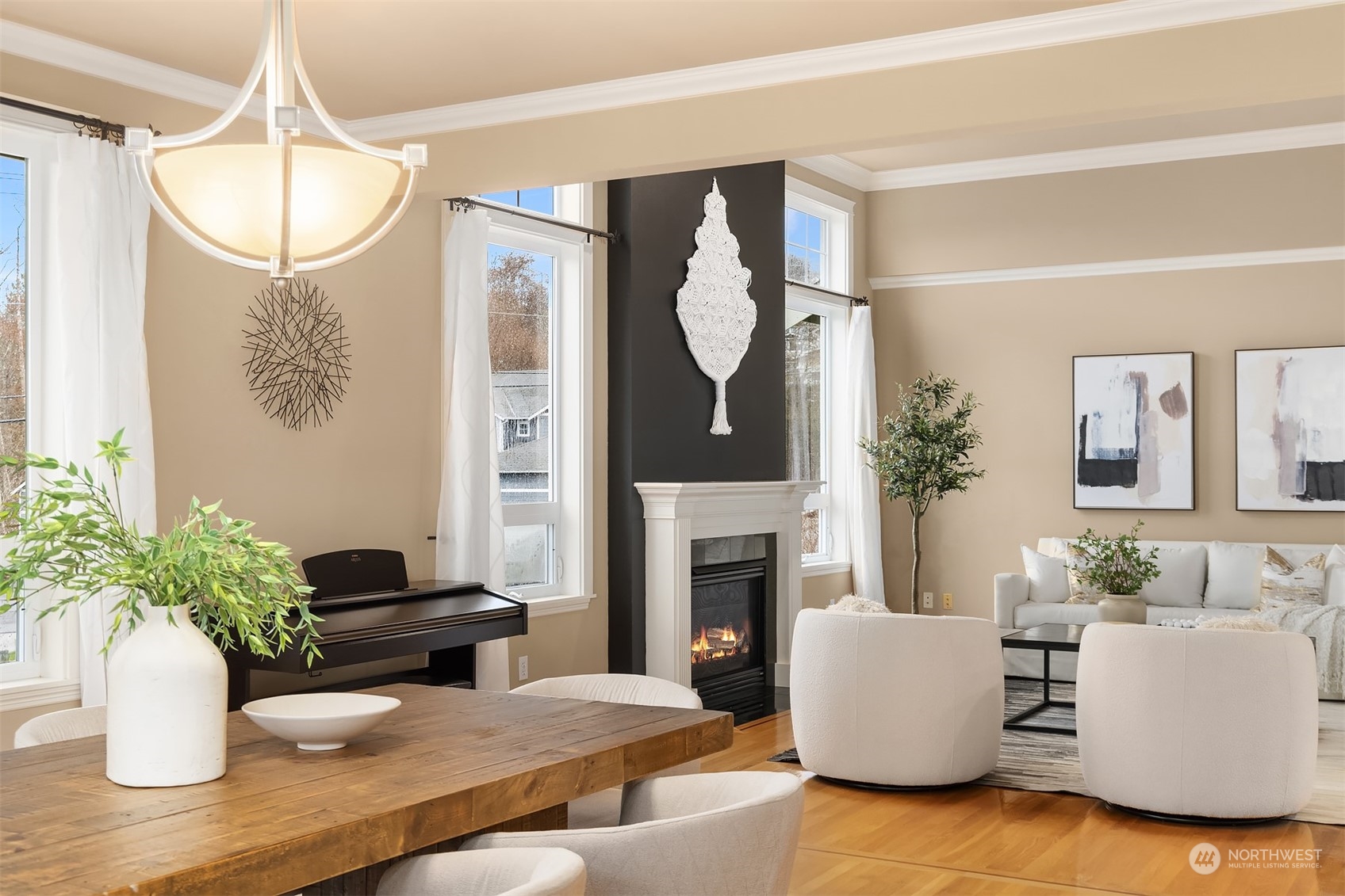 2202 19th Street Anacortes, WA 98221 - Photo 16 of 33 a living room with furniture a potted plant and a fireplace