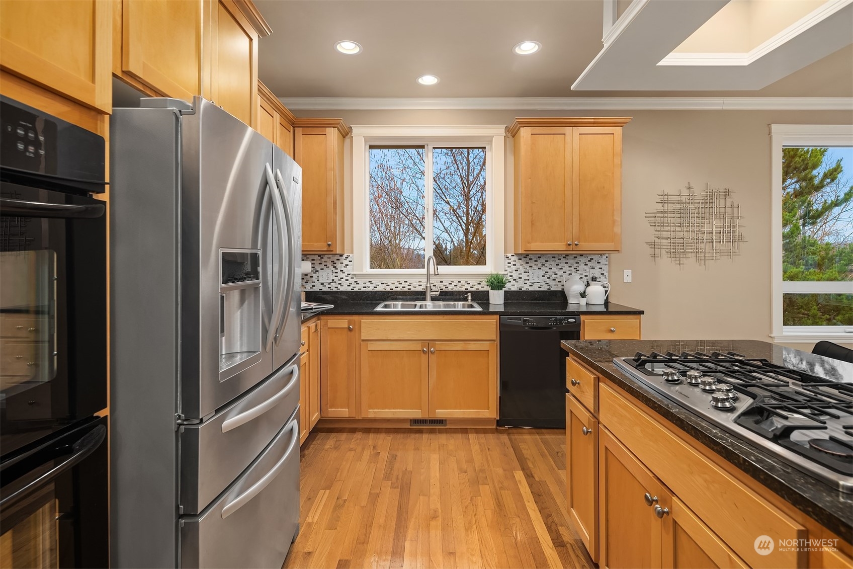 2202 19th Street Anacortes, WA 98221 - Photo 18 of 33 a kitchen with stainless steel appliances granite countertop a refrigerator and a stove