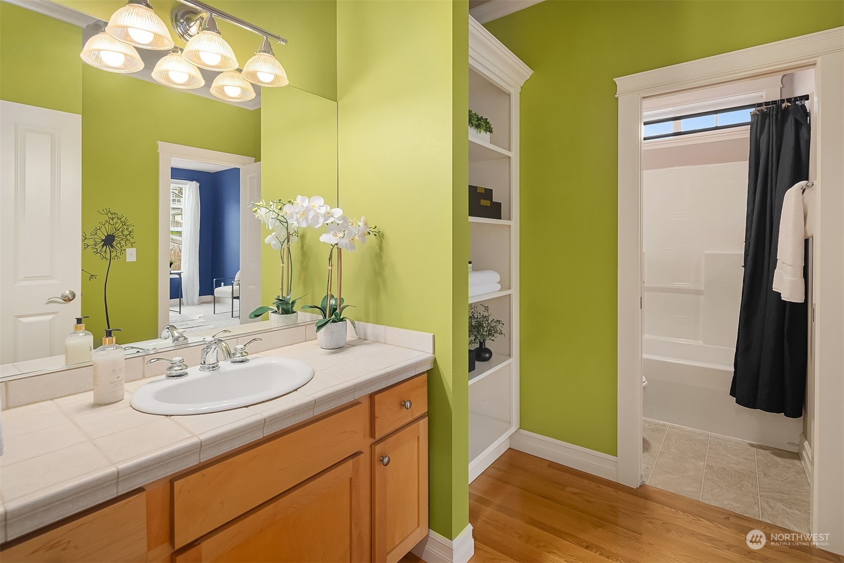 2202 19th Street Anacortes, WA 98221 - Photo 28 of 33 a bathroom with a sink vanity and a mirror