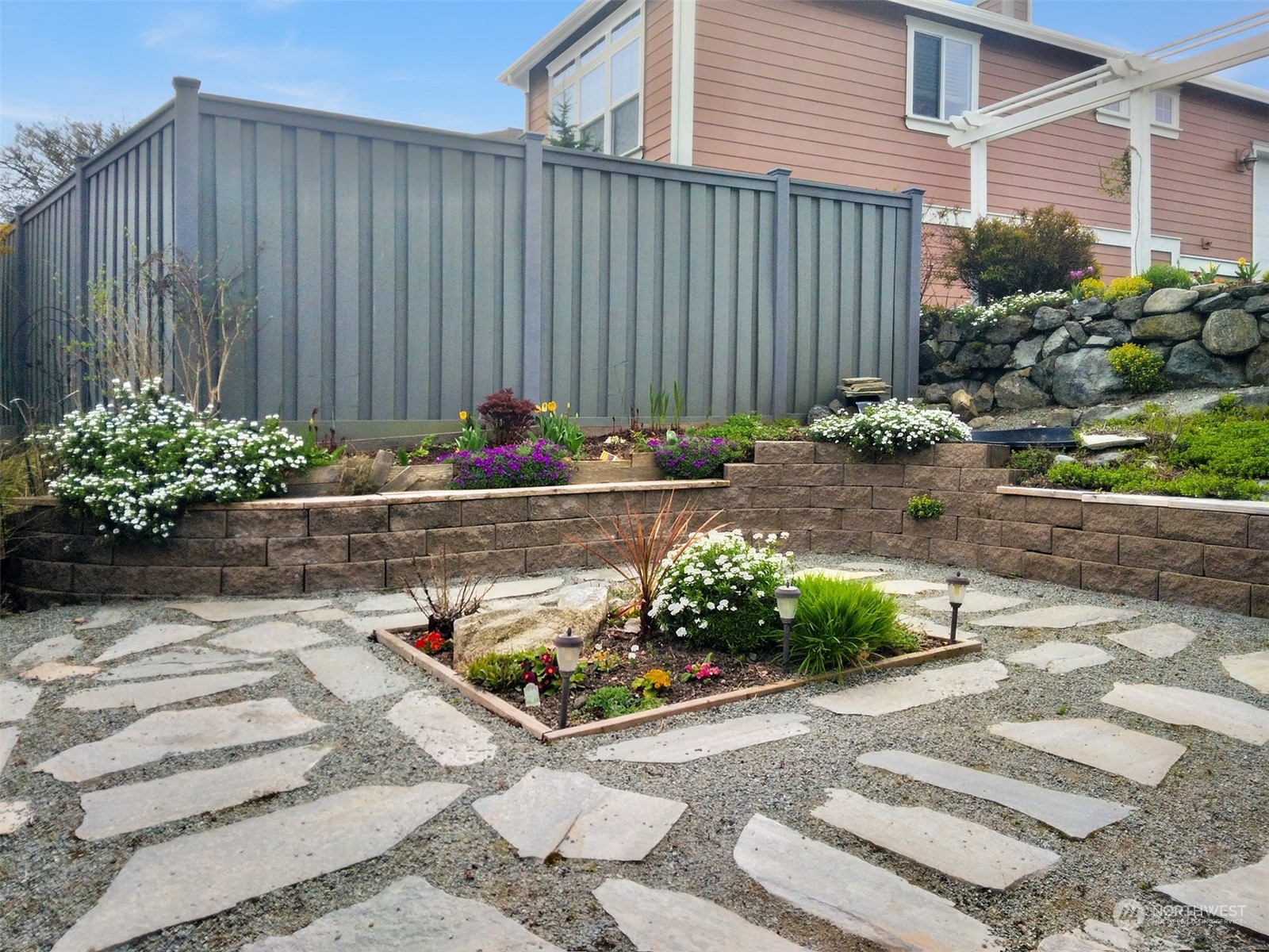 2202 19th Street Anacortes, WA 98221 - Photo 3 of 33 a wooden bench sitting in front of a house