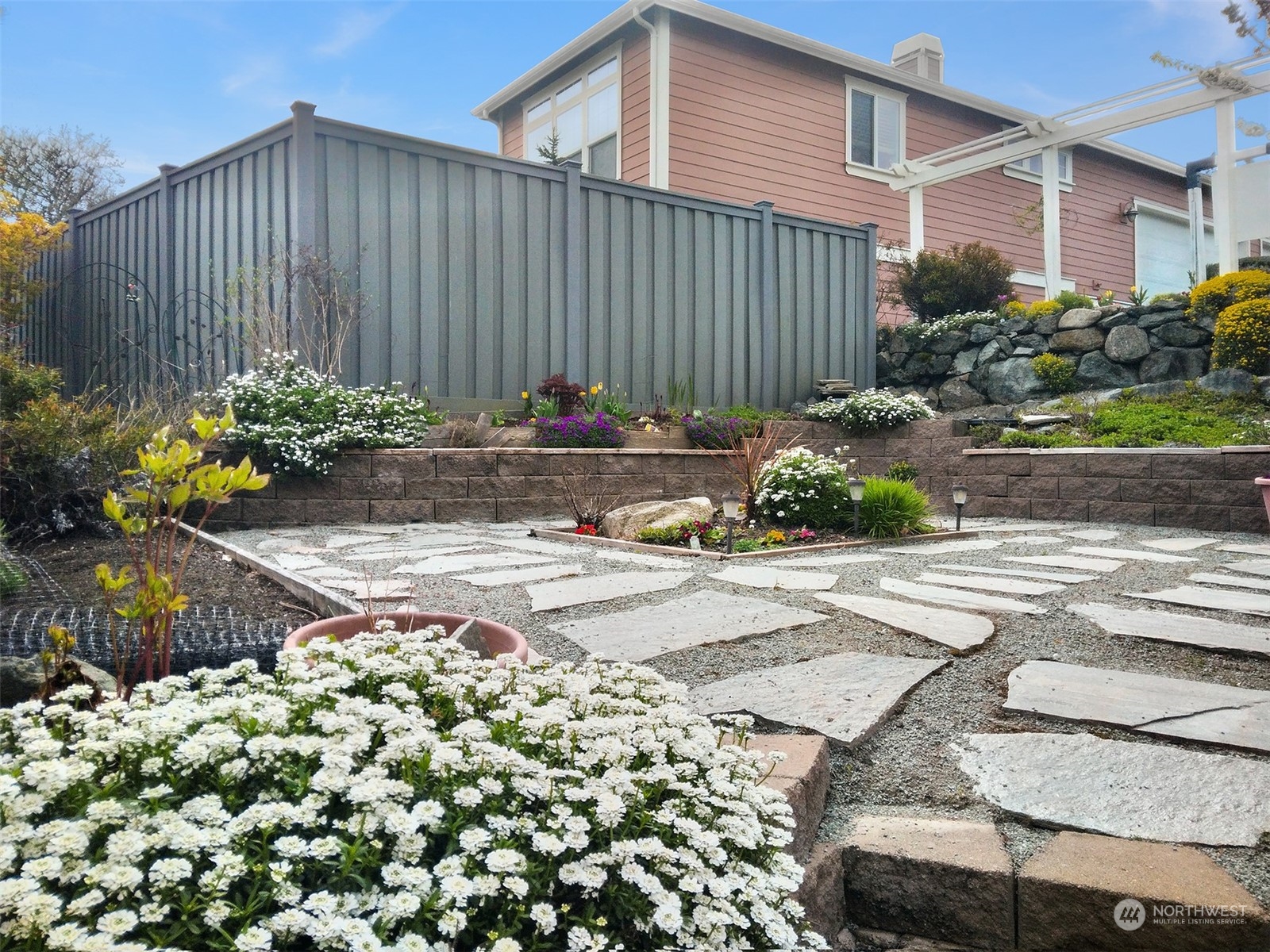 2202 19th Street Anacortes, WA 98221 - Photo 31 of 33 a view of a backyard with plants and flowers