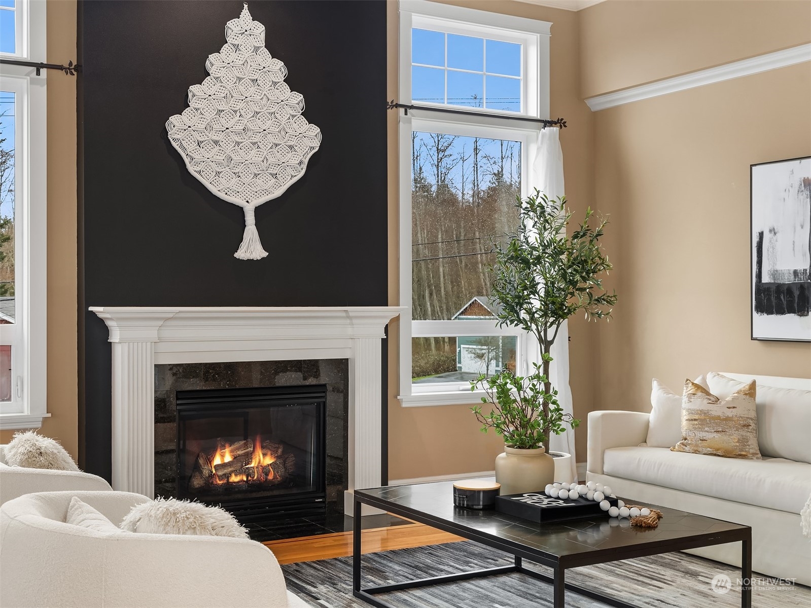 2202 19th Street Anacortes, WA 98221 - Photo 8 of 33 a living room with furniture a table and a fireplace