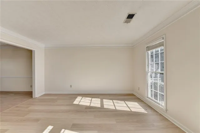 a view of an empty room and window