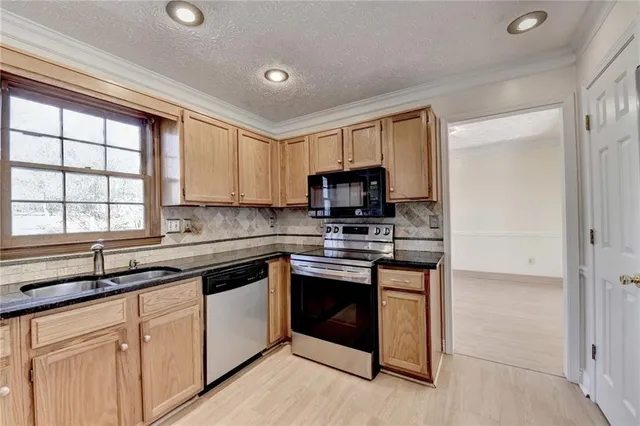 a view of a kitchen with windows