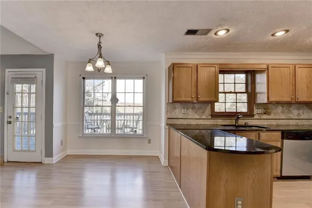 wooden floor fireplace and windows in an empty room