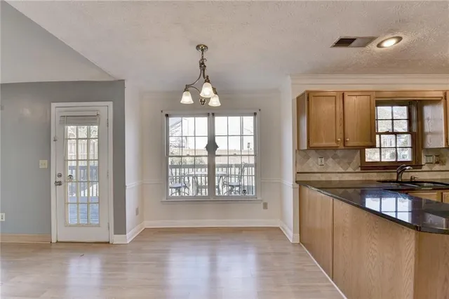 a bathroom with a sink mirror and toilet