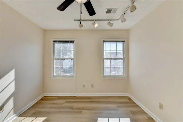 a bathroom with a bathtub sink and mirror