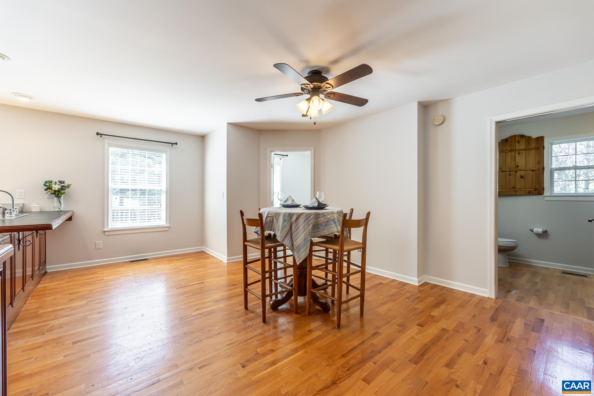 124 Fox Ridge Lane Ruckersville, VA 22968 - Photo 11 of 52 a view of a dining room with furniture and wooden floor