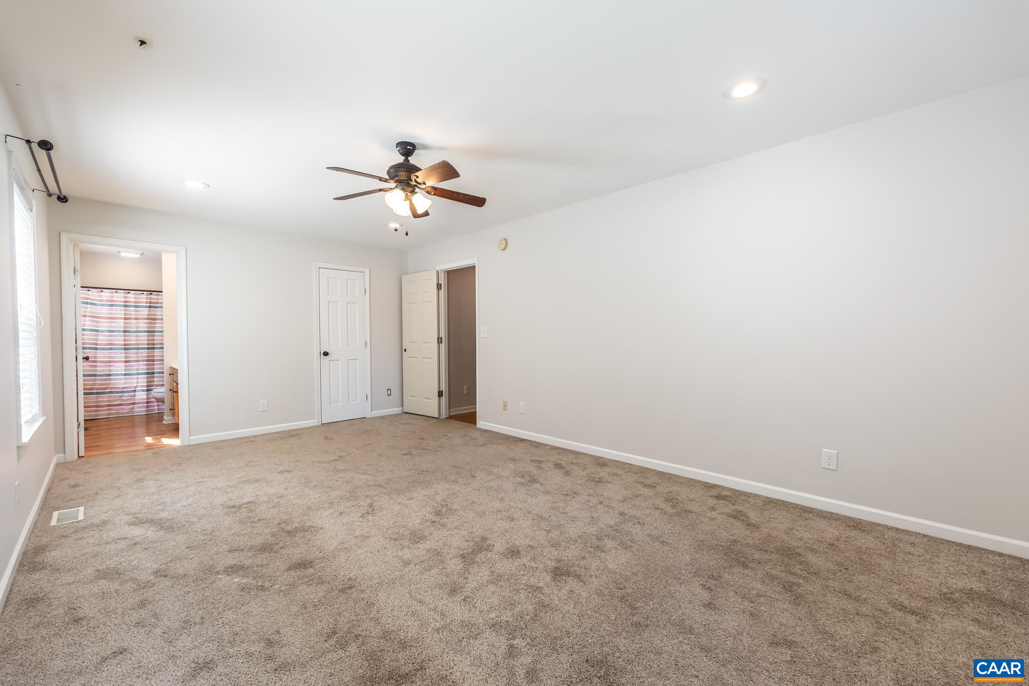 124 Fox Ridge Lane Ruckersville, VA 22968 - Photo 19 of 52 an empty room with a ceiling fan and a window