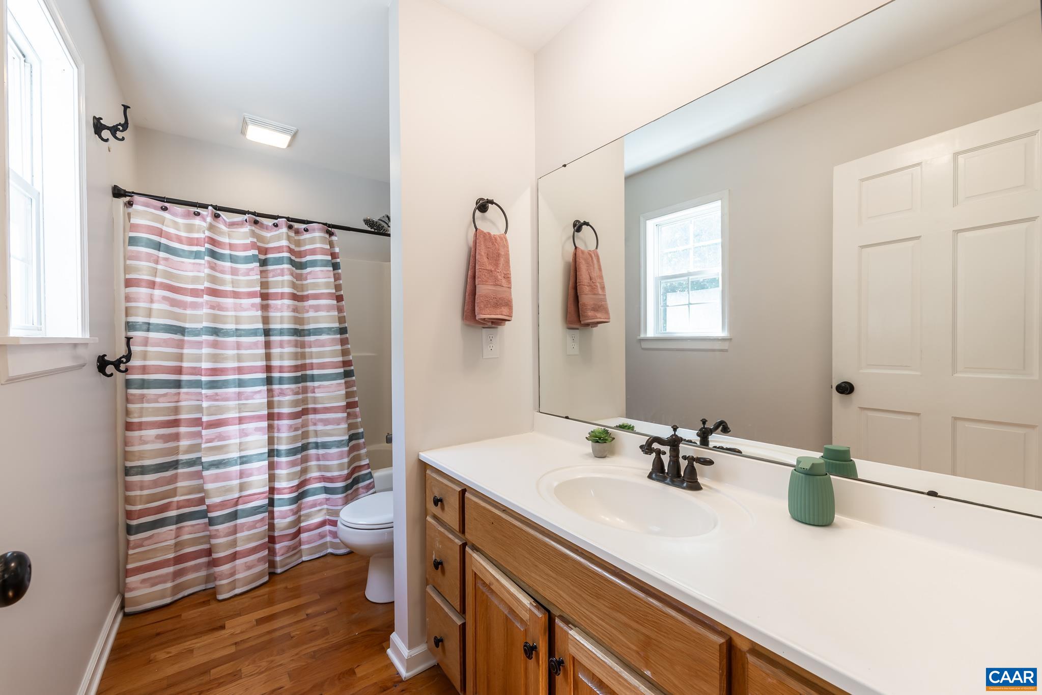 124 Fox Ridge Lane Ruckersville, VA 22968 - Photo 20 of 52 a bathroom with a sink a vanity and a shower