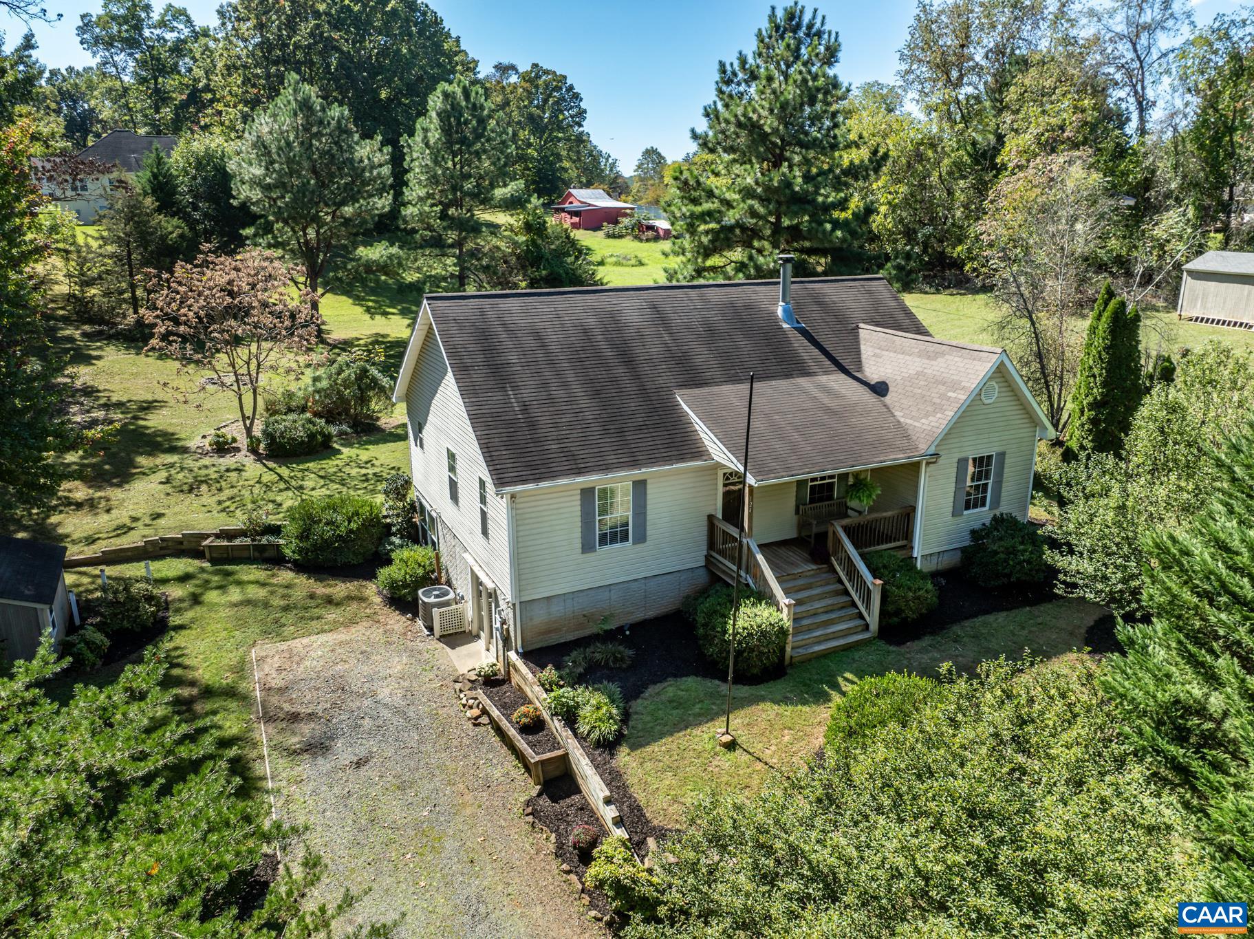 124 Fox Ridge Lane Ruckersville, VA 22968 - Photo 2 of 52 an aerial view of a house with swimming pool and garden