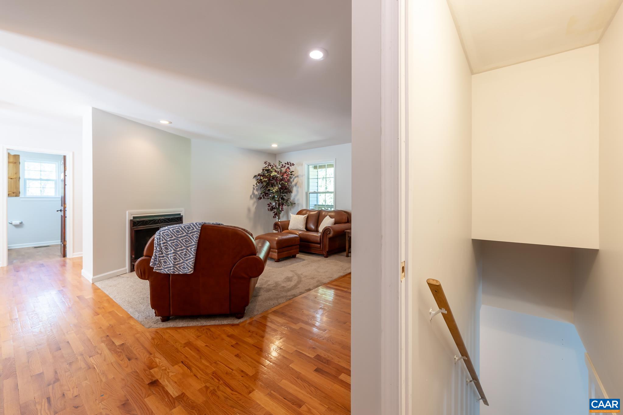 124 Fox Ridge Lane Ruckersville, VA 22968 - Photo 26 of 52 a living room with furniture and a hallway