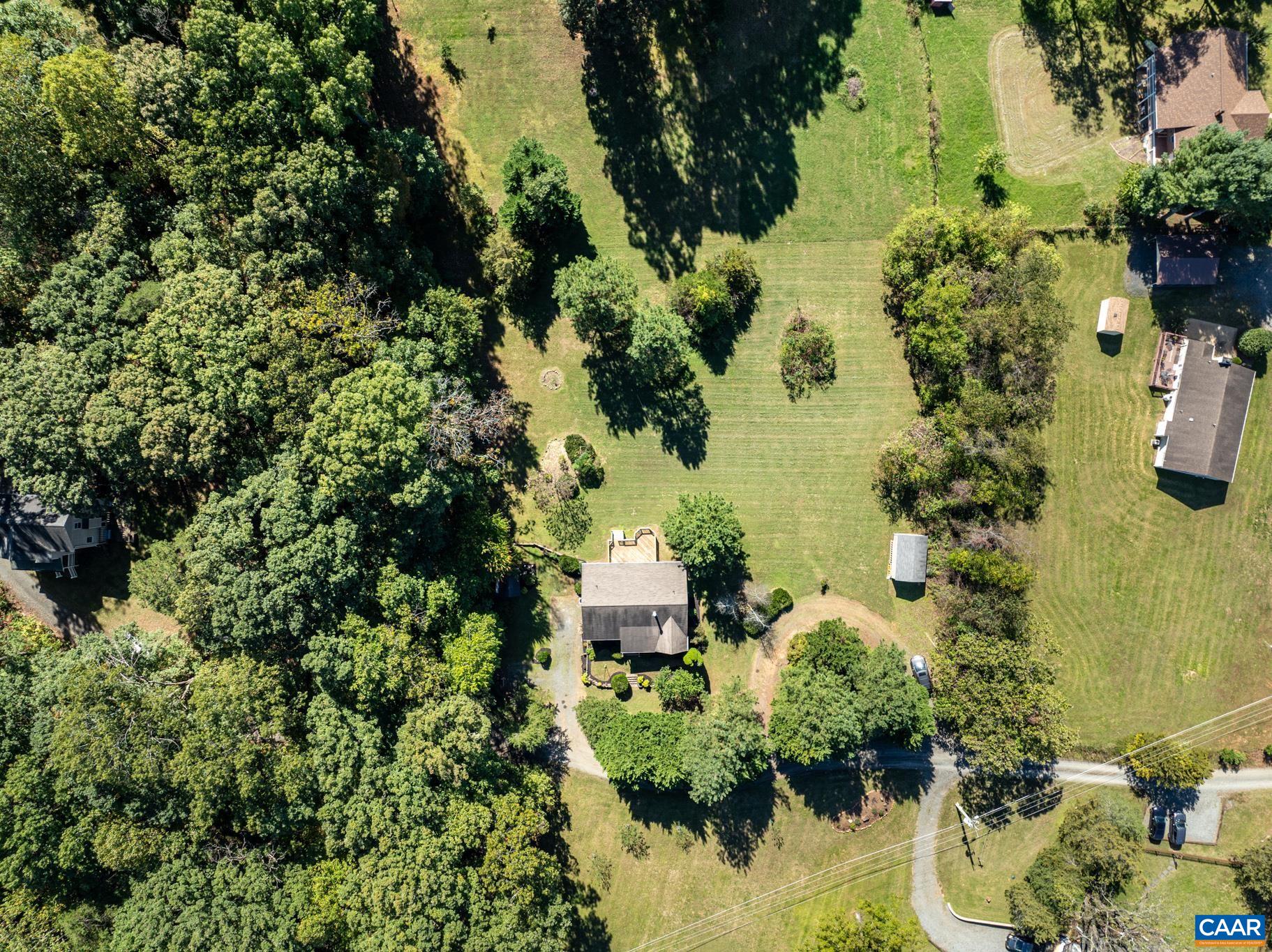 124 Fox Ridge Lane Ruckersville, VA 22968 - Photo 3 of 52 an aerial view of a house with a yard and lake view