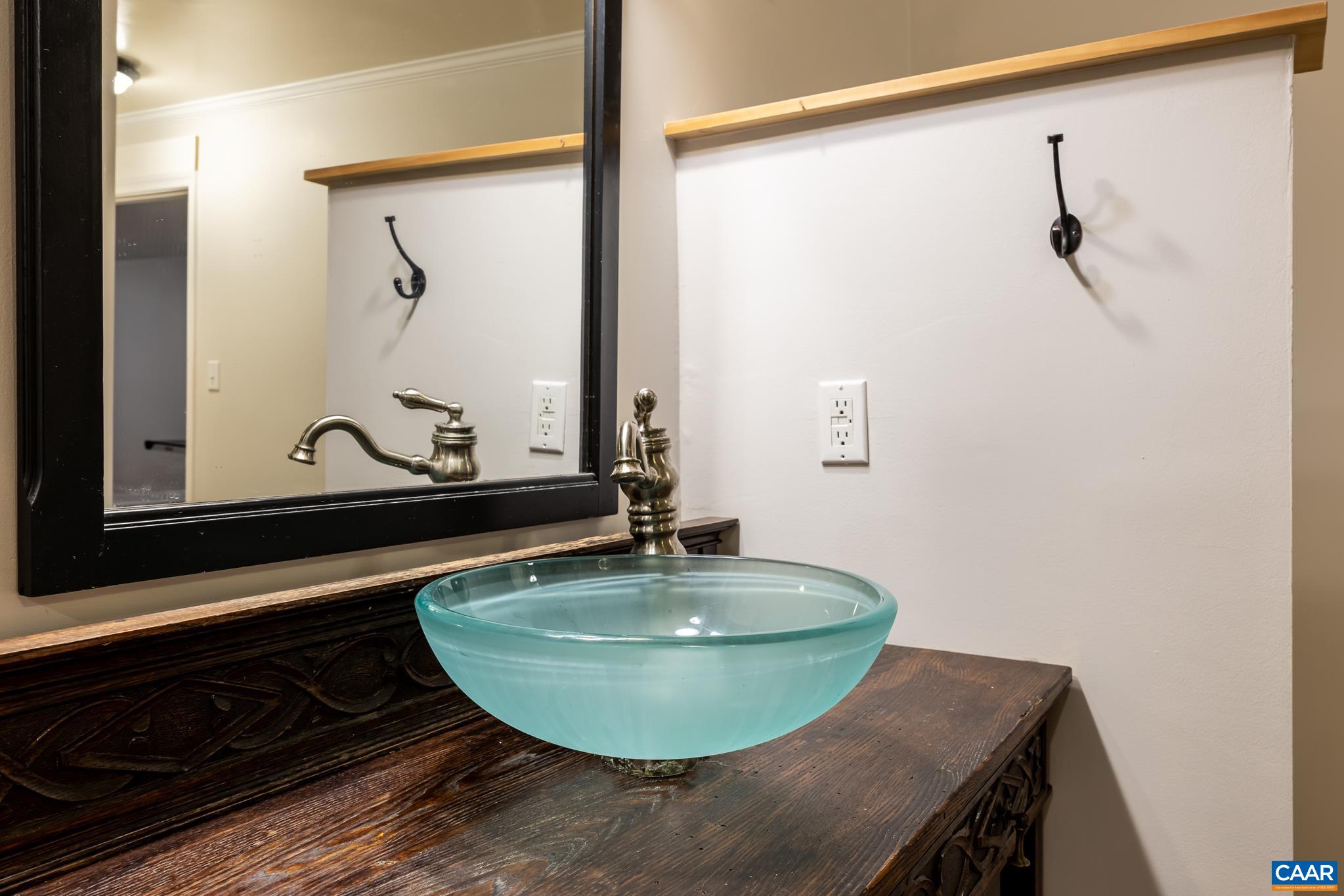 124 Fox Ridge Lane Ruckersville, VA 22968 - Photo 35 of 52 a view of a bathroom with a sink and mirror