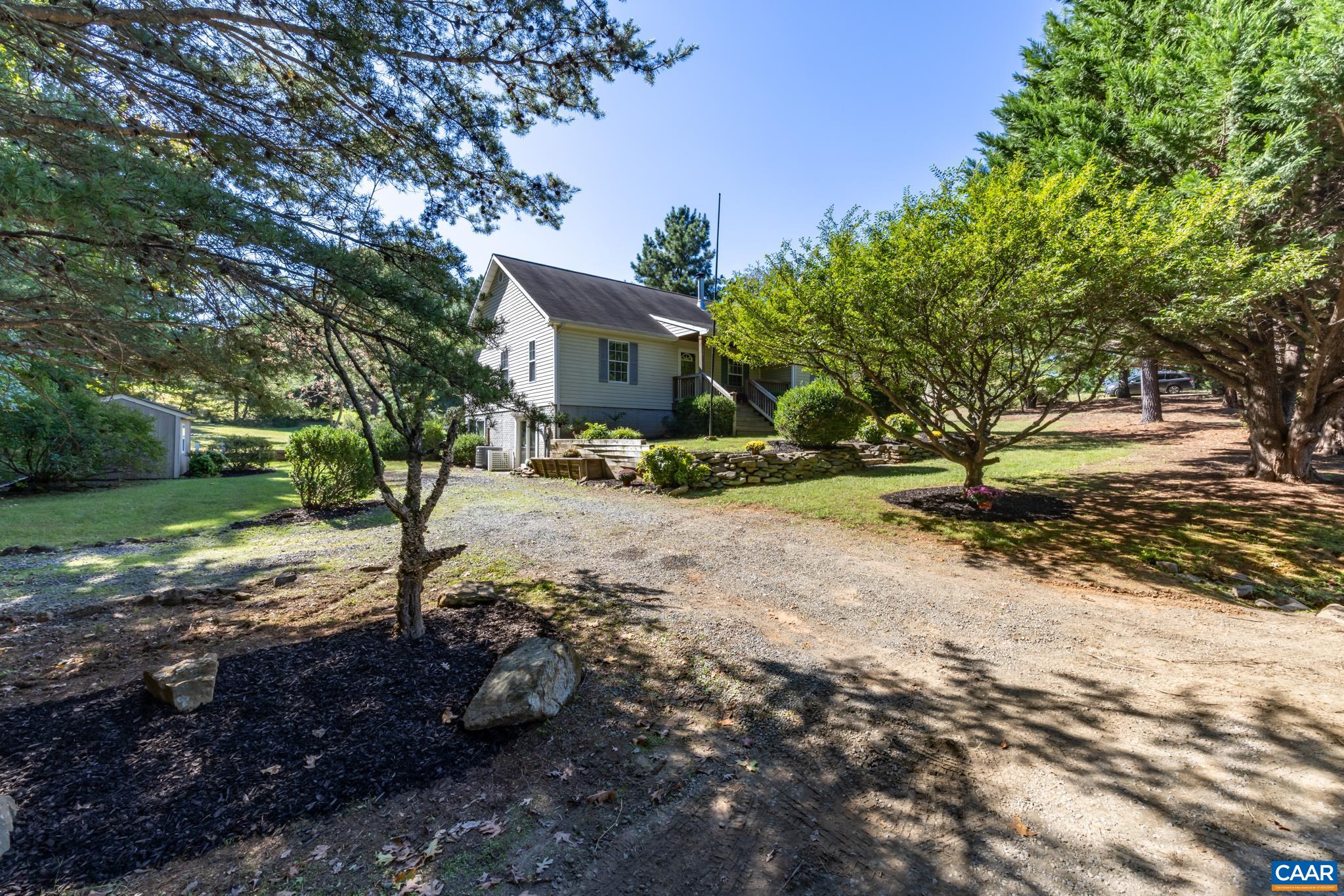 124 Fox Ridge Lane Ruckersville, VA 22968 - Photo 37 of 52 a street view with large trees