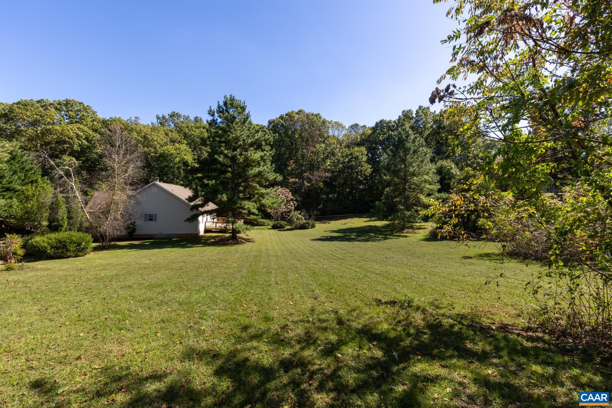 124 Fox Ridge Lane Ruckersville, VA 22968 - Photo 39 of 52 a backyard of a house with lots of green space