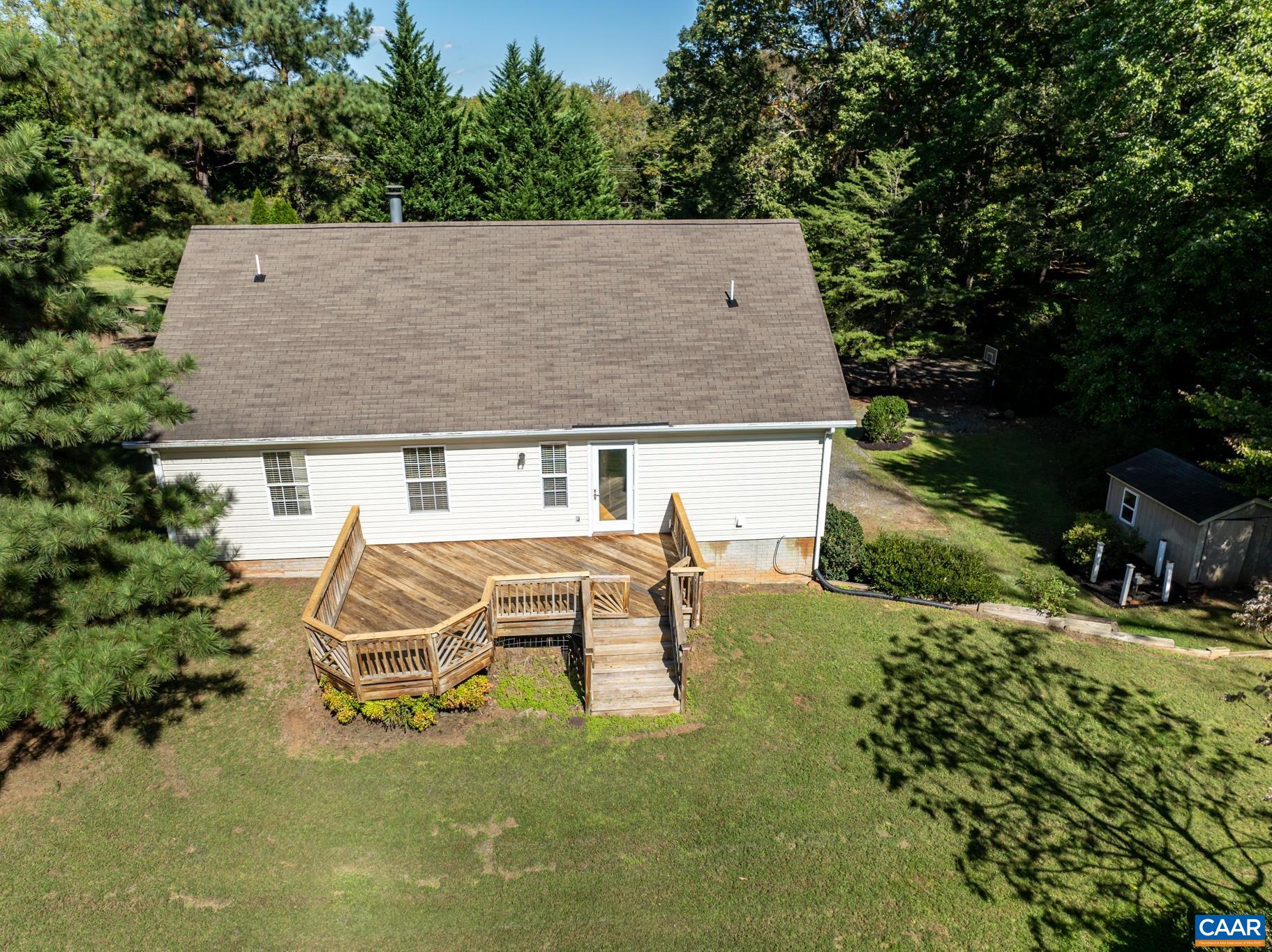 124 Fox Ridge Lane Ruckersville, VA 22968 - Photo 40 of 52 an aerial view of a house with table and chairs