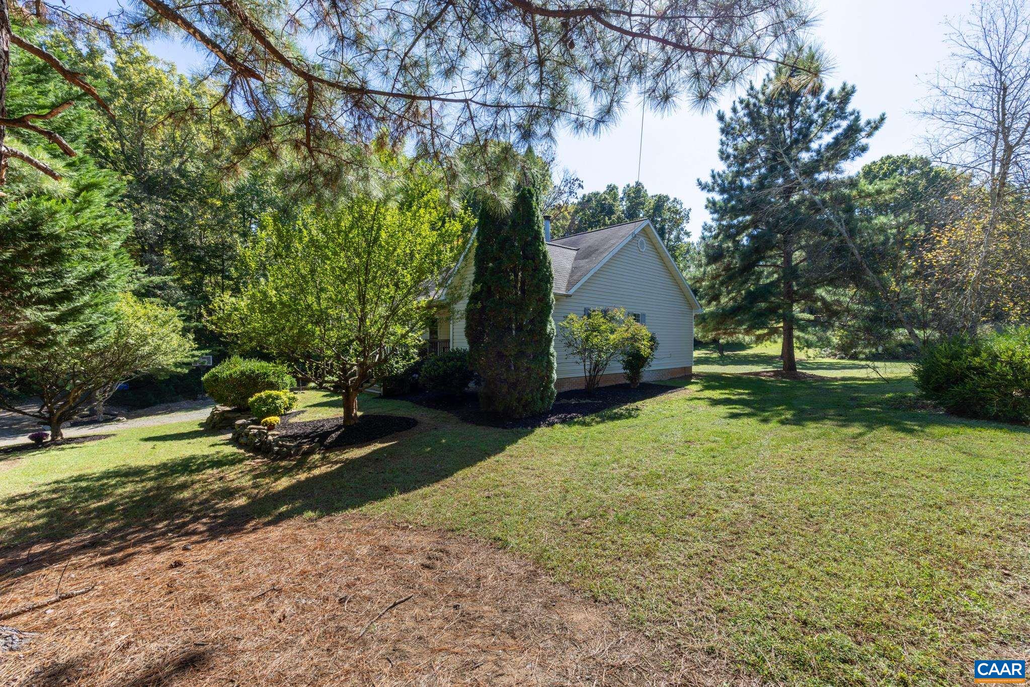 124 Fox Ridge Lane Ruckersville, VA 22968 - Photo 47 of 52 a front view of a house with garden