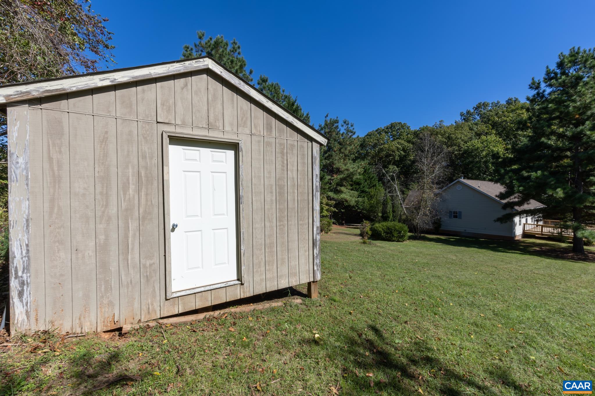 124 Fox Ridge Lane Ruckersville, VA 22968 - Photo 49 of 52 a front view of house with backyard and green space