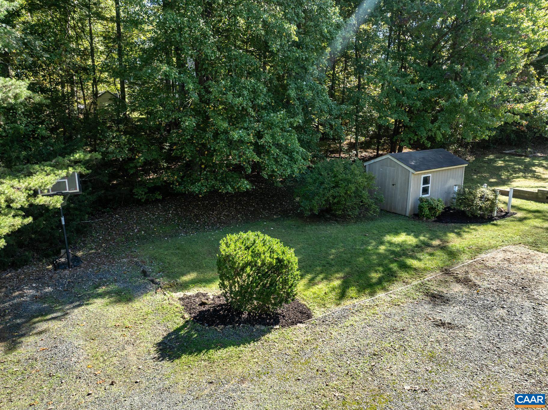 124 Fox Ridge Lane Ruckersville, VA 22968 - Photo 50 of 52 a view of a garden with a bench