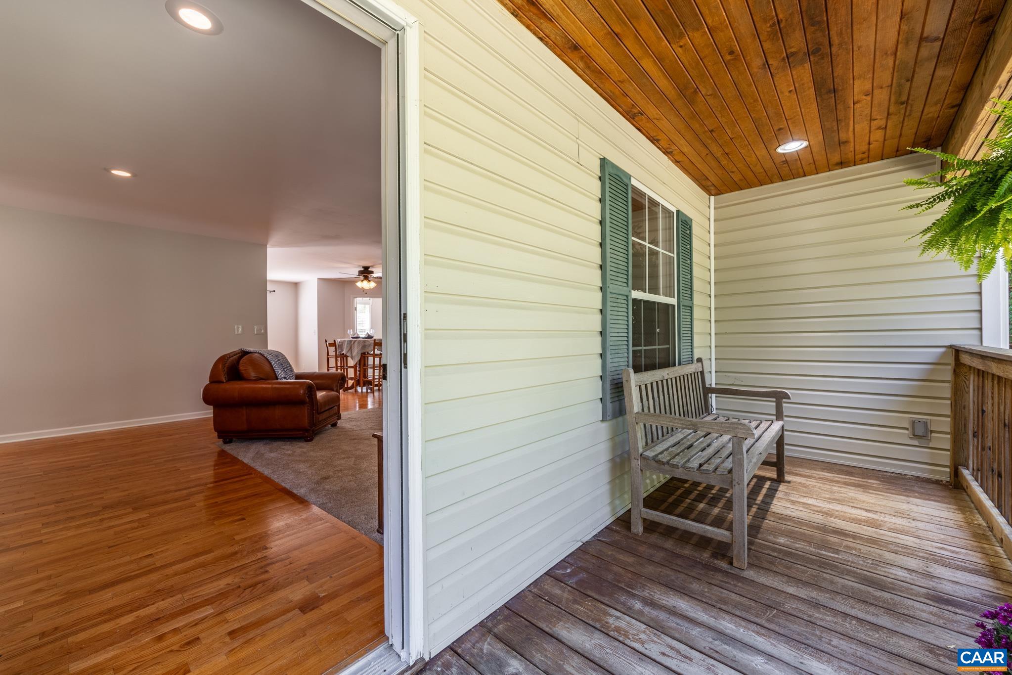 124 Fox Ridge Lane Ruckersville, VA 22968 - Photo 7 of 52 a view of a patio with chair and wooden floor