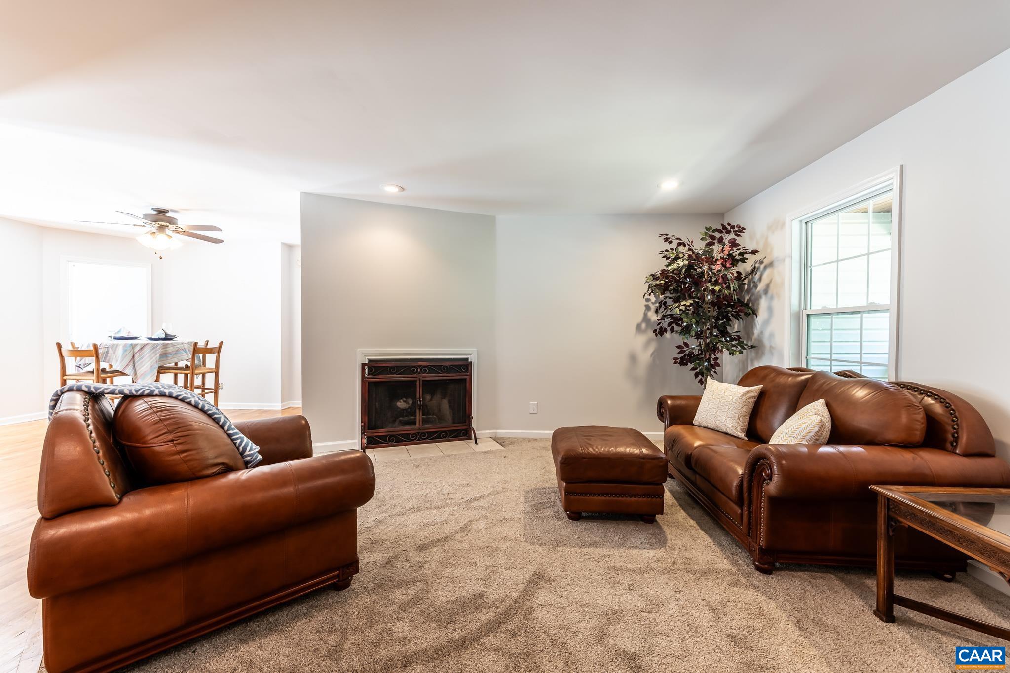 124 Fox Ridge Lane Ruckersville, VA 22968 - Photo 10 of 52 a living room with furniture and a fireplace