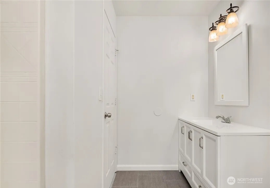 4050 South Puget Sound Avenue Tacoma, WA 98409 - Photo 12 of 19 a view of a bathroom with a sink