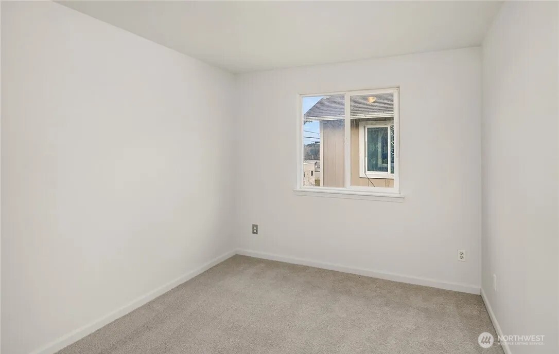 4050 South Puget Sound Avenue Tacoma, WA 98409 - Photo 13 of 19 an empty room with a window