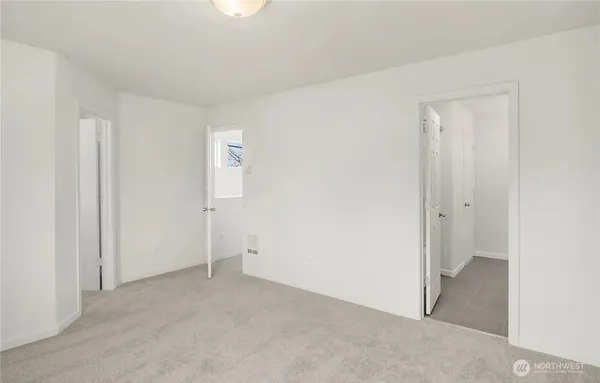 a view of a hallway with washer and dryer