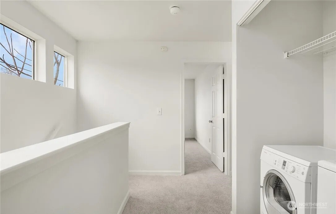 4050 South Puget Sound Avenue Tacoma, WA 98409 - Photo 18 of 19 a view of a hallway with washer and dryer