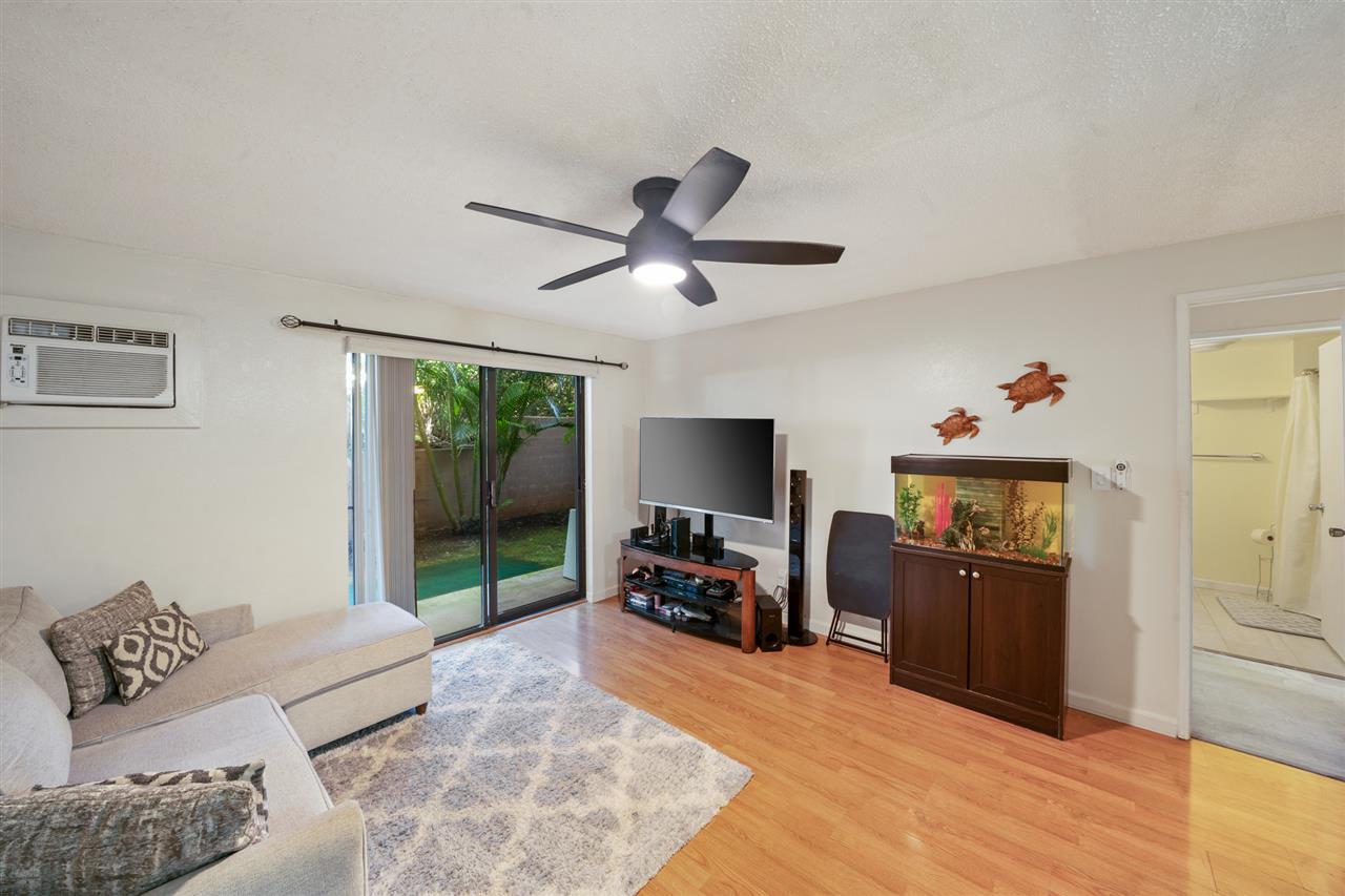 2747 South Kihei Road, Unit C005 Kihei, HI 96753 - Photo 2 of 29 a living room with furniture and a flat screen tv
