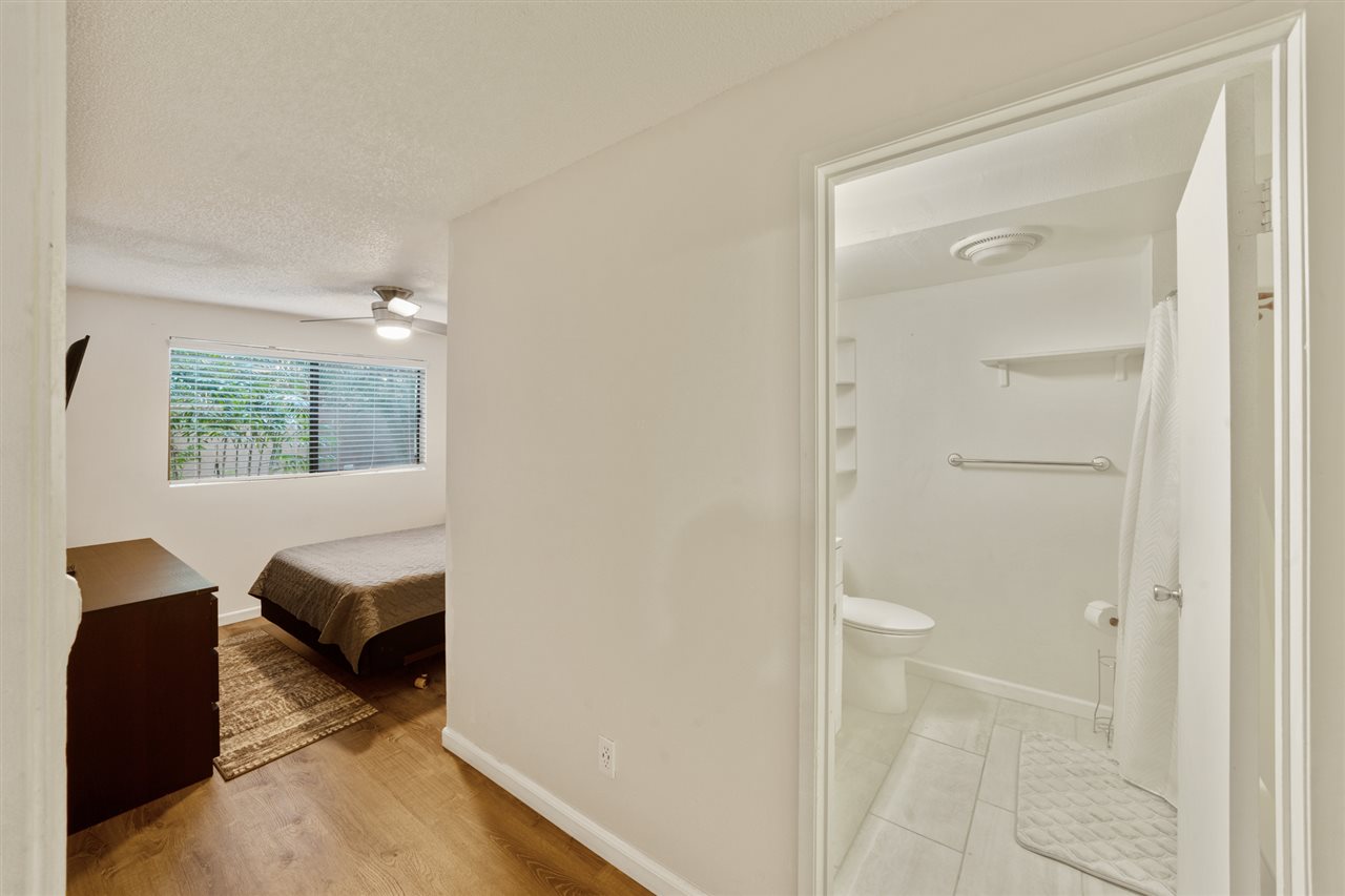 2747 South Kihei Road, Unit C005 Kihei, HI 96753 - Photo 21 of 29 a view of bedroom with a bed and wooden floor