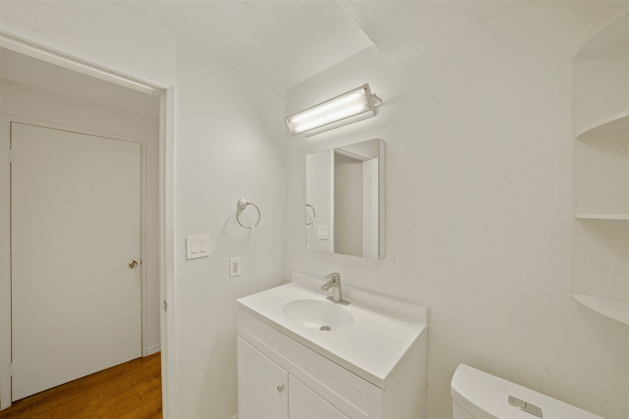 2747 South Kihei Road, Unit C005 Kihei, HI 96753 - Photo 22 of 29 a bathroom with a toilet a sink and mirror
