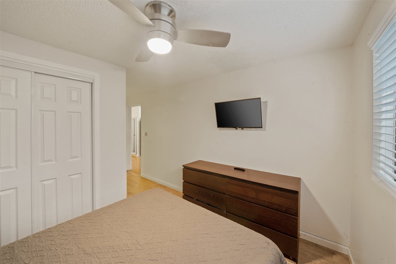 2747 South Kihei Road, Unit C005 Kihei, HI 96753 - Photo 24 of 29 a bedroom with a bed and a flat screen tv