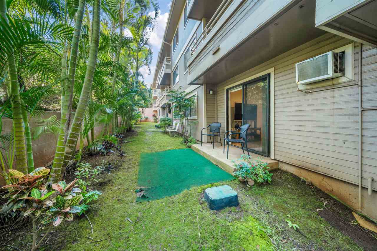 2747 South Kihei Road, Unit C005 Kihei, HI 96753 - Photo 26 of 29 a view of a chair and table in backyard of the house