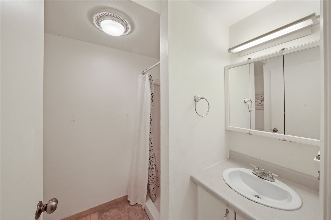 2747 South Kihei Road, Unit C005 Kihei, HI 96753 - Photo 5 of 29 a bathroom with a granite countertop sink toilet and a mirror