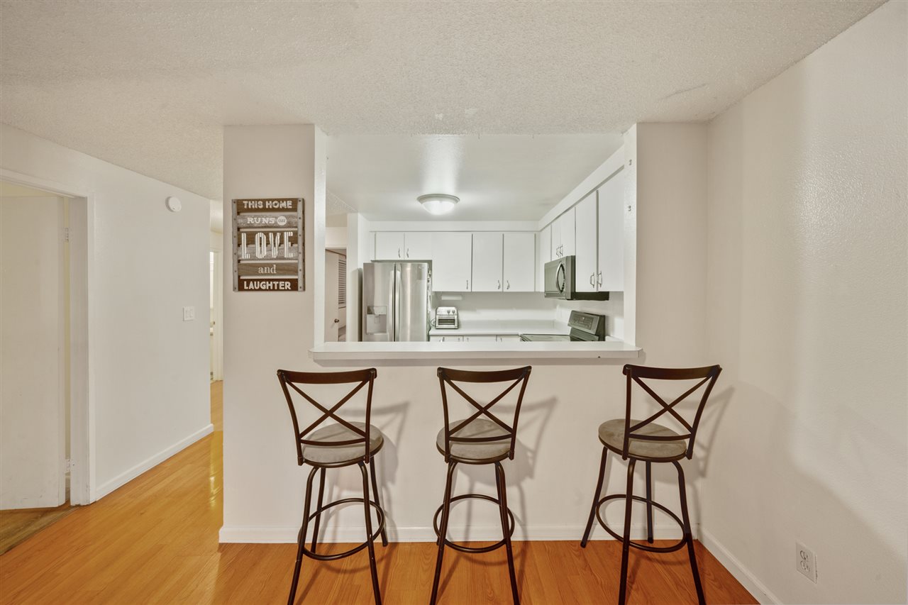 2747 South Kihei Road, Unit C005 Kihei, HI 96753 - Photo 8 of 29 a view of a dining room with chairs and wooden floor