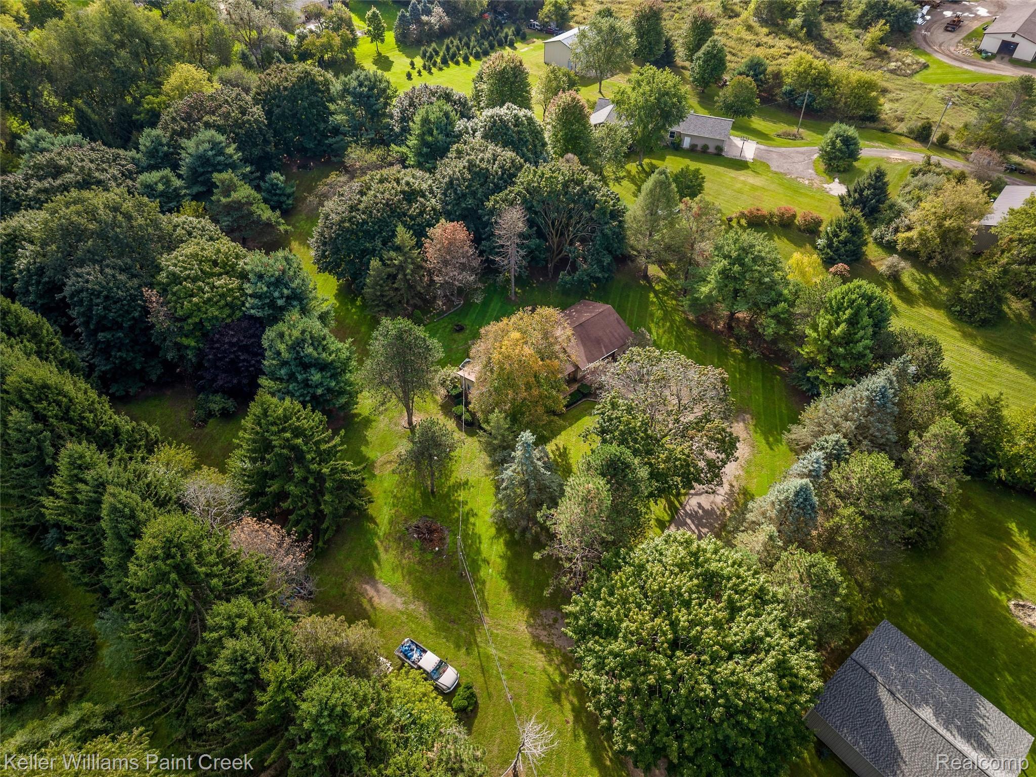 5077 Pinckney Road Howell, MI 48843 - Photo 29 of 39 Expansive property featuring mature trees and lush green lawns