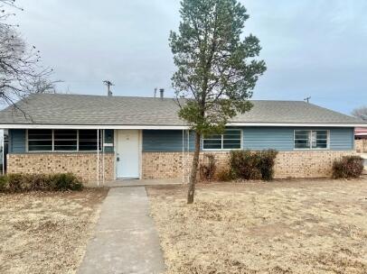2802 40th Street Lubbock, TX 79413 - Photo 1 of 11 a front view of a house with a yard